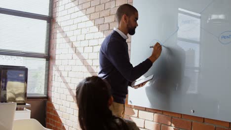 businessman explaining over white board 4k