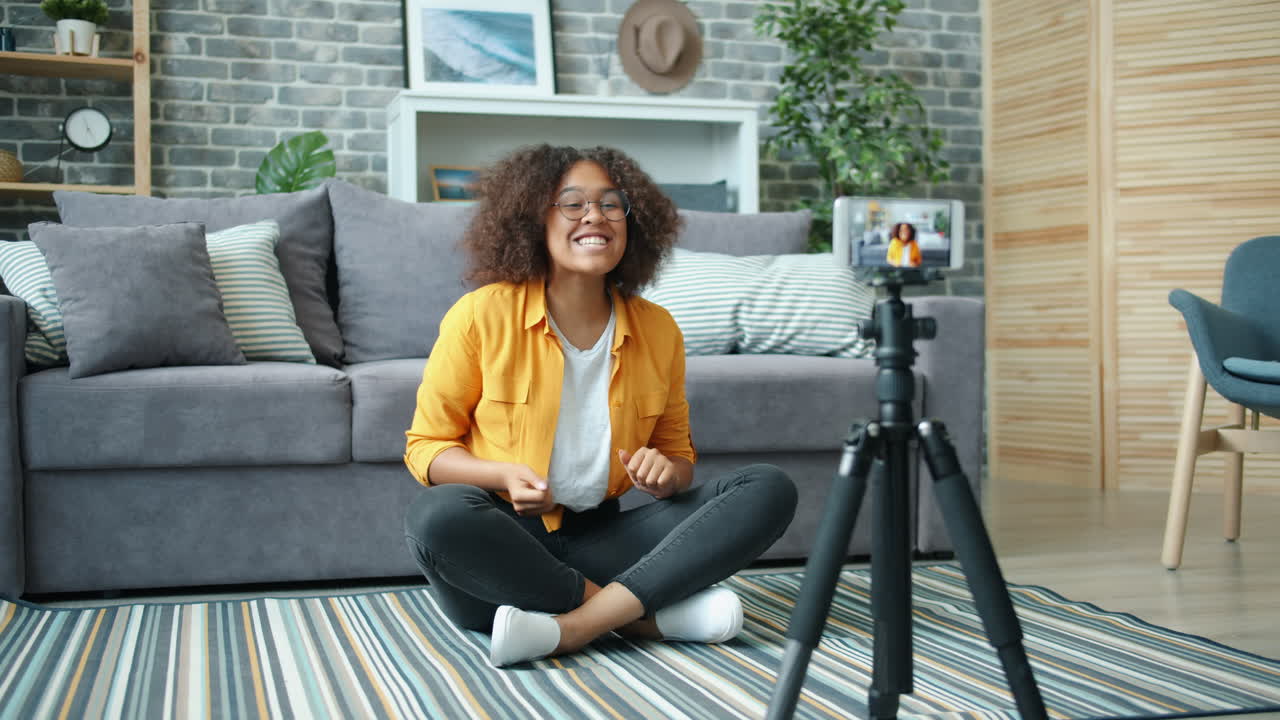 Young Woman Recording a Video Blog at Home