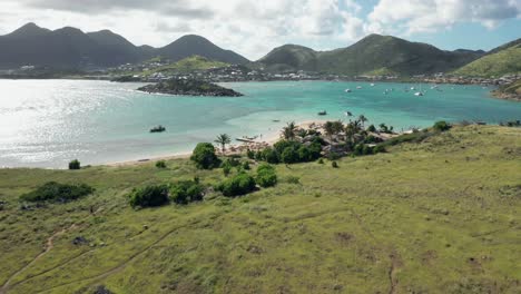 aerial view of sunny saint martin mountains from ilet de pinel