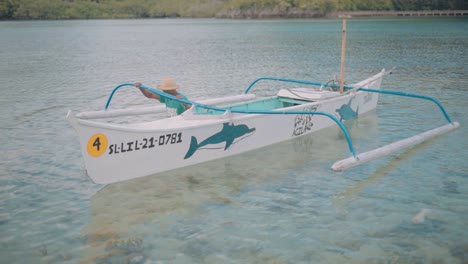 outrigger wooden boat use for touring vacationists in the islands at the philippnes