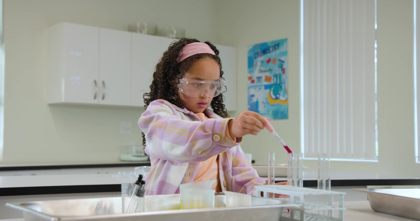 Teen African-American pupil after teacher cue, drawing with pink pipet into tubes for lab at school