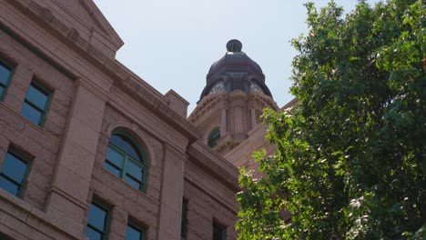 Low-angle-wide-shot-of-the-Tarrant-County-Courthouse-in-Fort-Worth,-Texas