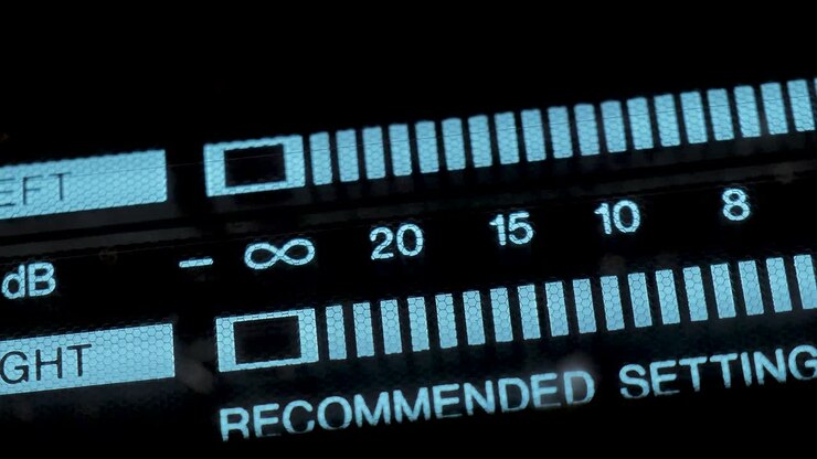 Audio signal levels monitoring audio console on classic sound amplifier. Led Vu Meter Vintage Macro.