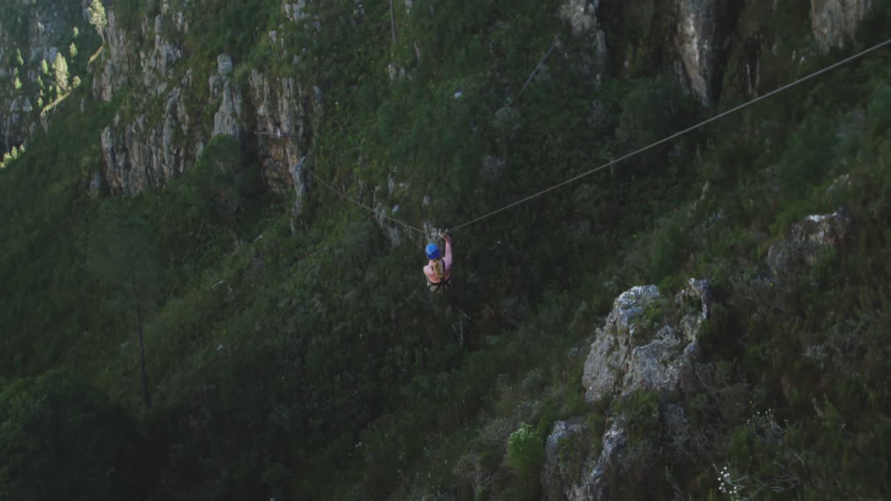 Young Caucasian woman zip lining
