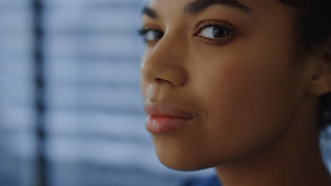 African-american-business-woman-looking-at-window.-Corporate-professional