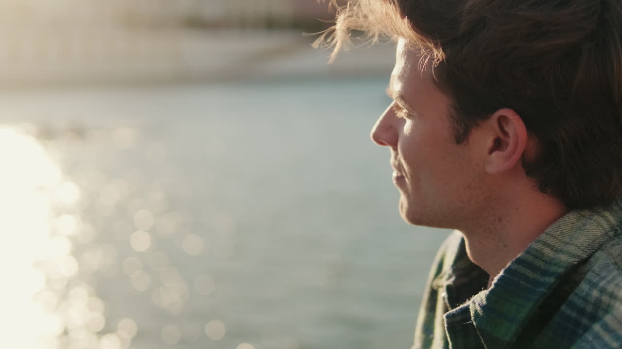 Thoughtful Young Man by the Guadalquivir River