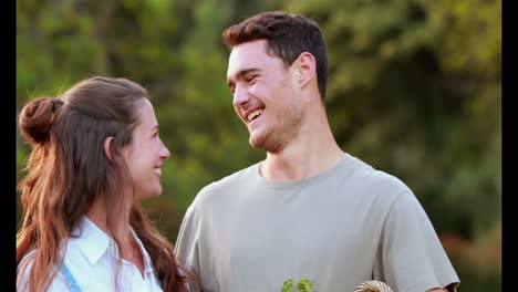 Young-couple-holding-a-basket-of-vegetables