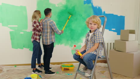 family painting a room