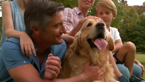 happy family in the park with their dog