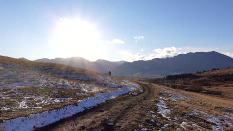 mountain bikers riding a rural trail