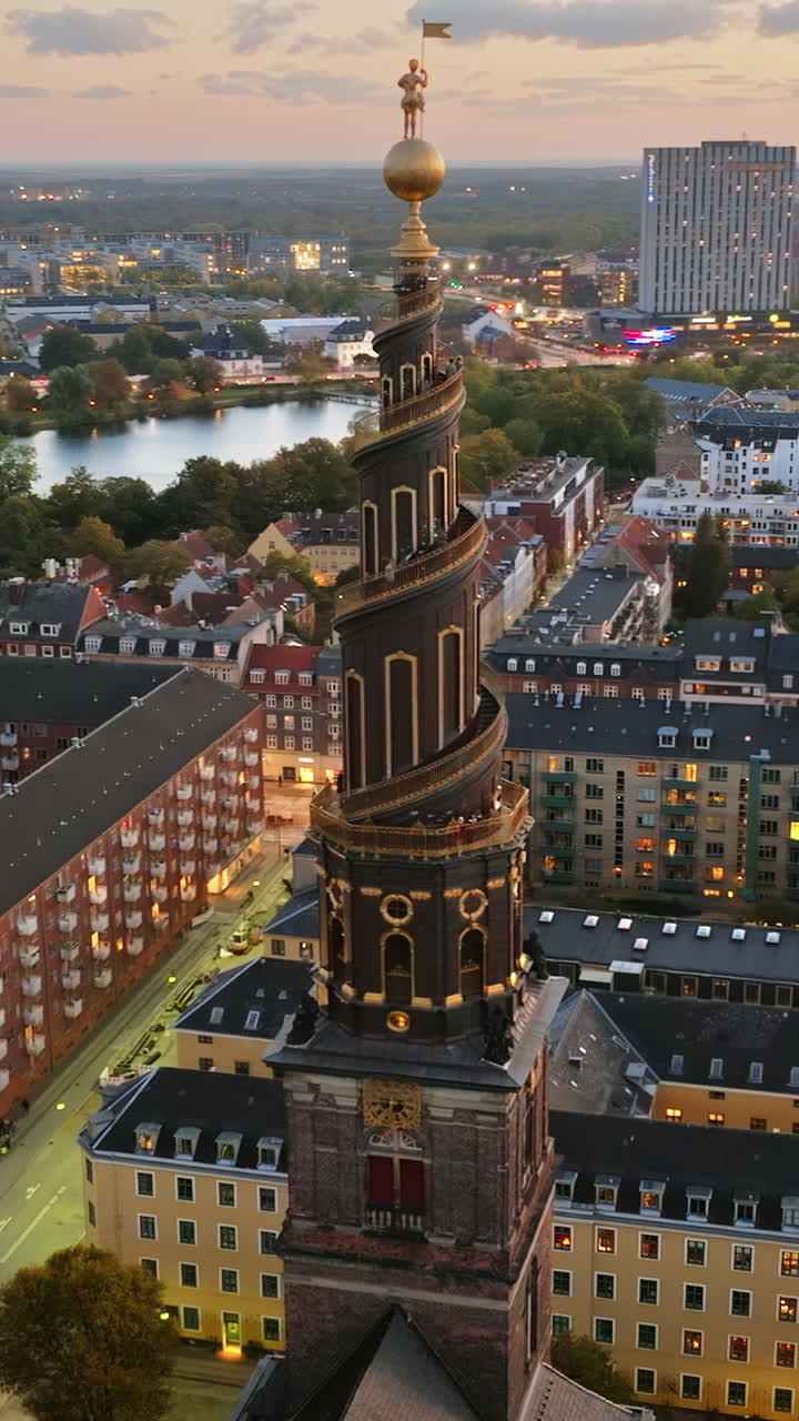 Aerial drone view of the Church of Our Saviour in the city centre of Copenhagen, Denmark in the evening. Vertical