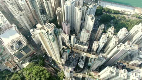 Downtown-Hong-Kong-city-skyscrapers-and-urban-traffic,-Aerial-view