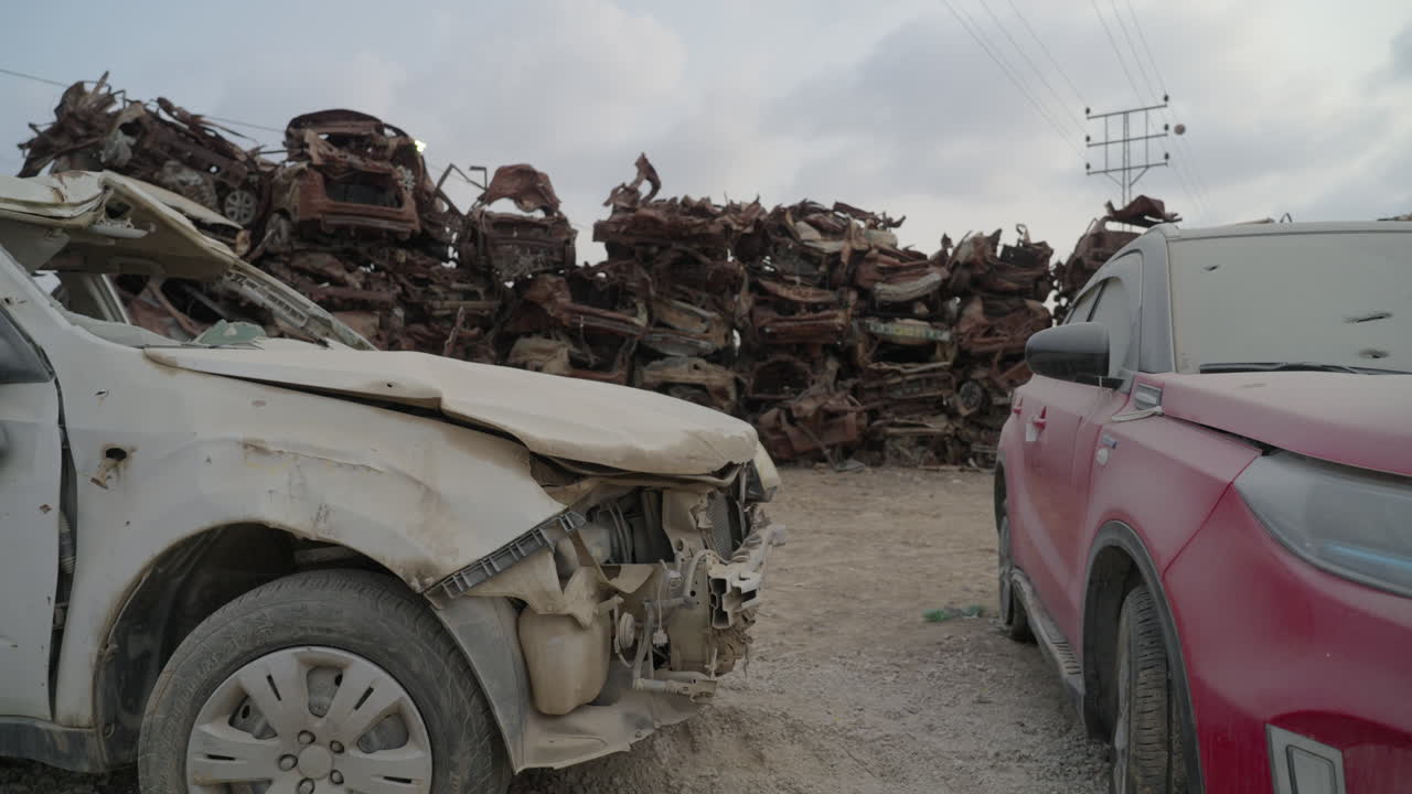 Wall of cars in the burnt vehicle lot memorial, Tkuma Israel after Hamas Attack