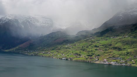 thin misty clouds hanging above the water of hardanger fjord