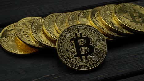 bitcoin coins on dark wooden background