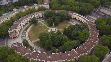 Dramatic-aerial-top-view-flight-Ghetto-Building-Mehringplatz-place-city-Berlin-steglitz,-Germany-Summer-day-2023