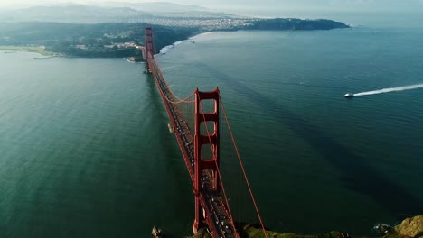 towering golden gate structure casting vast shadows over quiet morning ocean usa