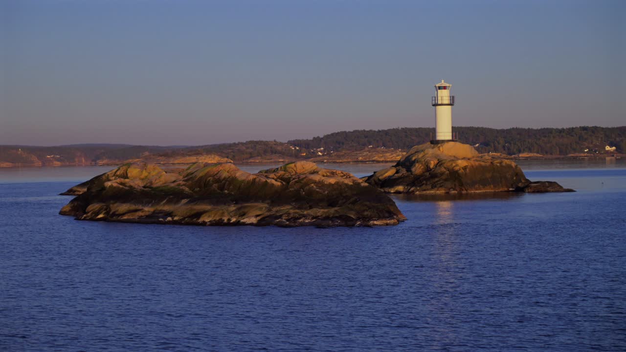 Lighthouse Strömstad Stromstad Fjord Ursholmen Sweden sea ferry boat ride land of the Svea Sverige calm sea ocean water arctic afternoon sunset Nordkoster enchanting coastal reflection circle motion