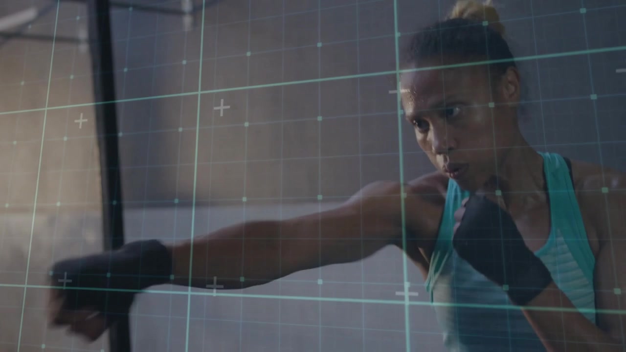 Woman from guard throwing rapid punch combos for fitness, grid tracking metrics, holding guard