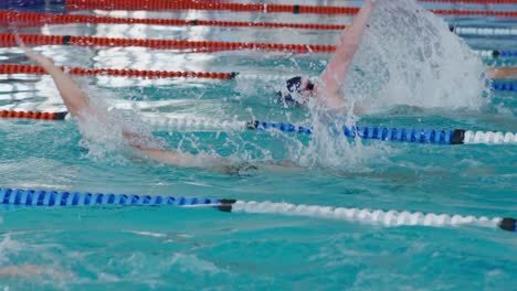 swimmers swimming into the pool