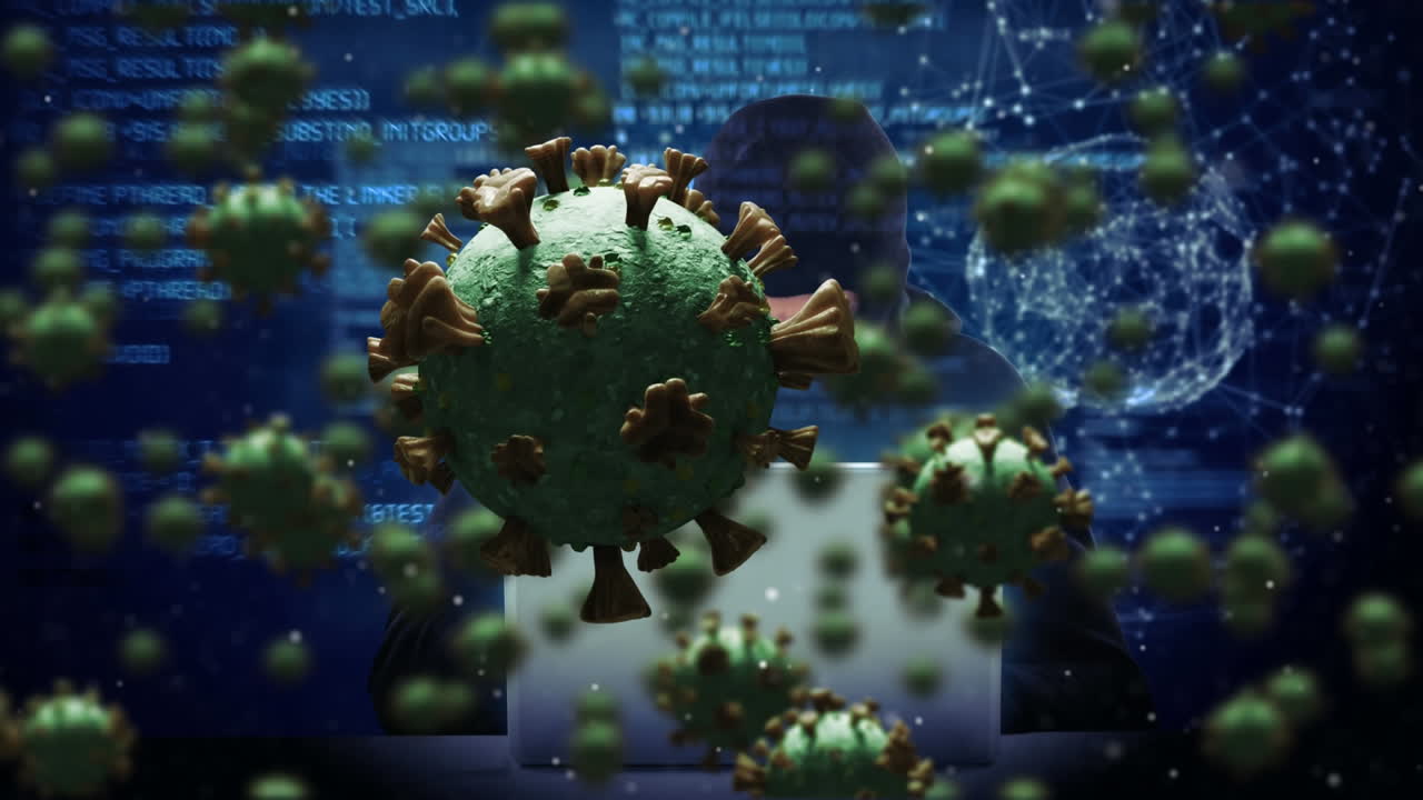 노트북을 사용하여 발라클라바를 입은 남성에 대한 거대한 코로나19 세포의 애니메이션