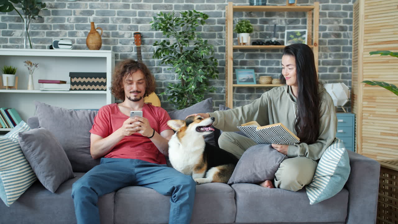 Couple Relaxing at Home with Dog