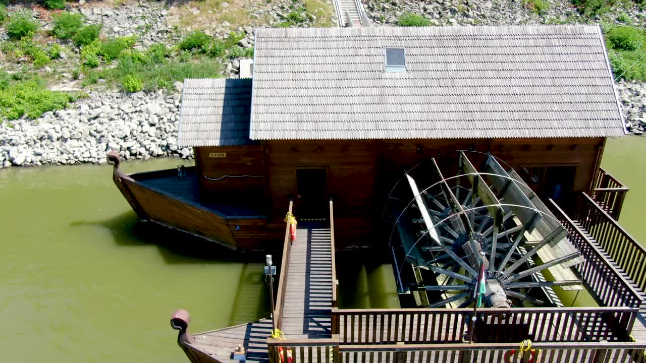 Aerial view of ship mill with large water wheel on Danube River, Baja Hungary.