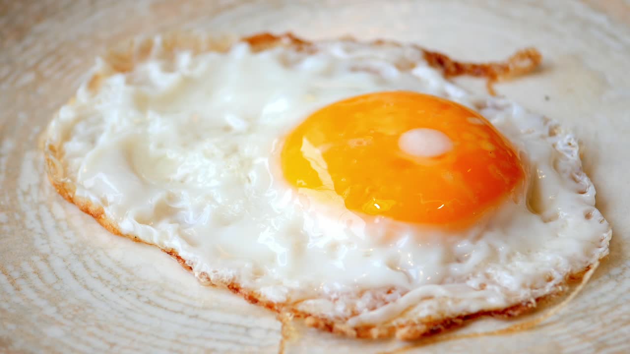 Fried eggs in the plate close up ,,