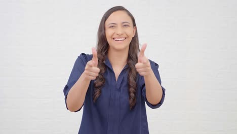 Indian-girl-pointing-and-smiling