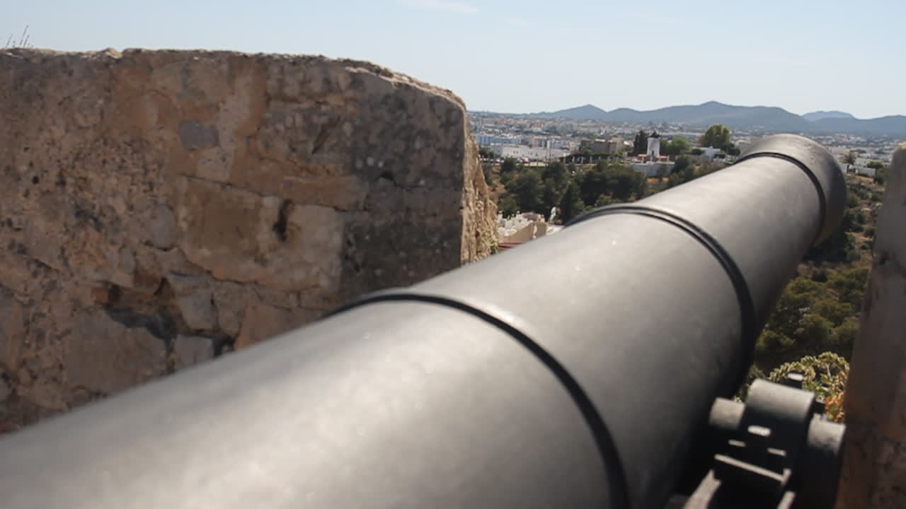 Cannon at a historic site overlooking a city