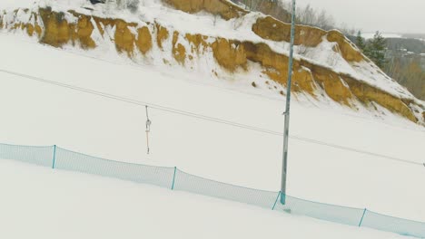 motion past t-bar lift at ski resort track on nasty day