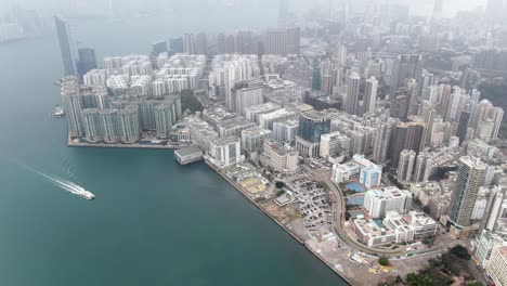 hong kong bay coastline and waterfront skyscrapers, aerial view