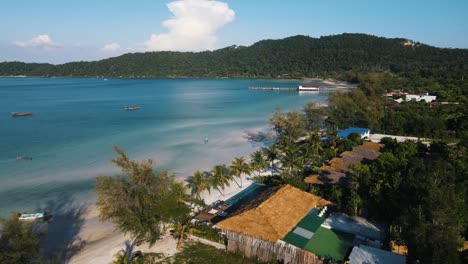 beautiful tourist resorts on the beautiful white sandy beaches between the green palm trees on the clear blue sea in koh rong sanloem cambodia