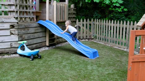 Siblings-playing-on-slide-4k