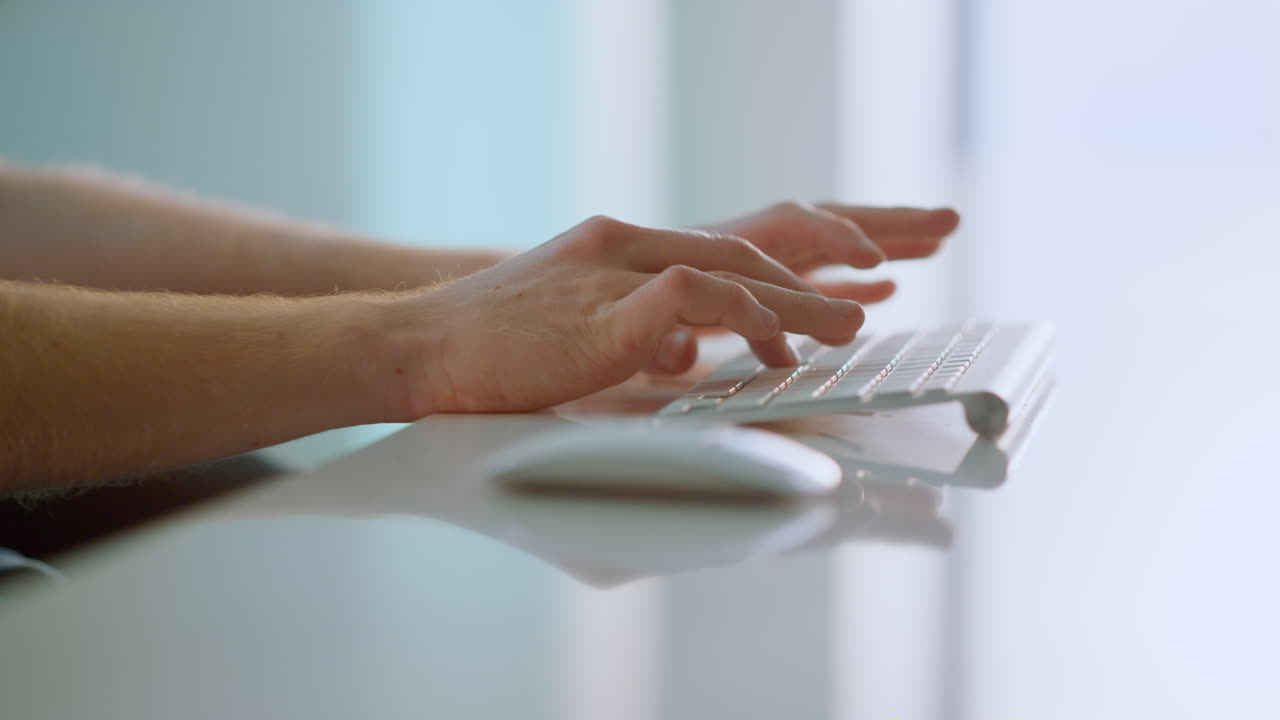 Manager hands typing computer keyboard in office. Unknown man writing email.