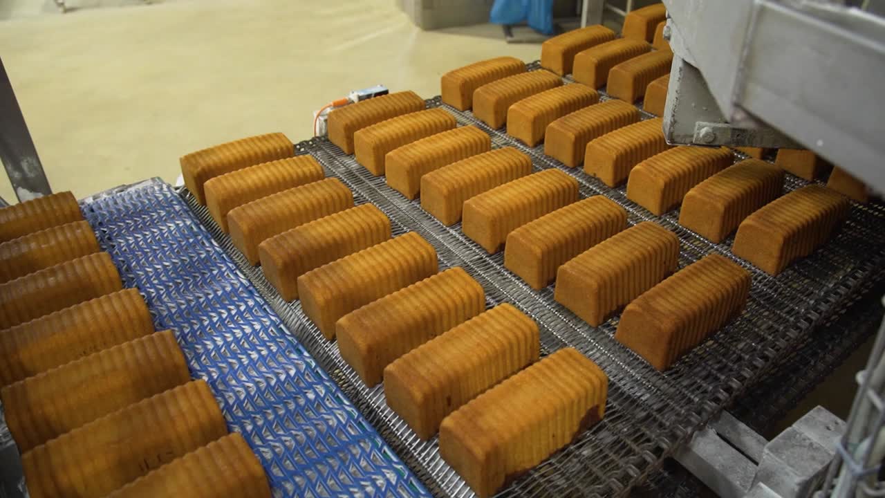 Marble cake factory line production on a conveyor belt