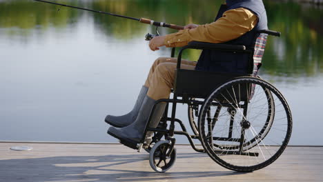 disabled man fishing from wheelchair