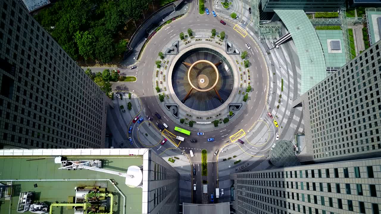 Top aerial drone view of traffic movement at Fountain of Wealth, Suntec City.