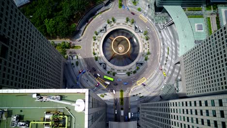 top aerial drone view of traffic movement at fountain of wealth, suntec city.