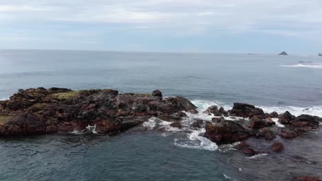 Aerial-Drone-View-of-Ocean-Waves-Crashing-on-Rocks-in-Sri-Lanka