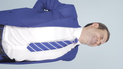 Vertical-video-of-Businessman-experiencing-back-pain.