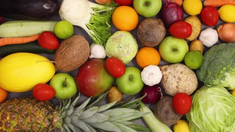 kitchen table full with moving fresh organic and ripe healthy fruits and vegetables. stop motion