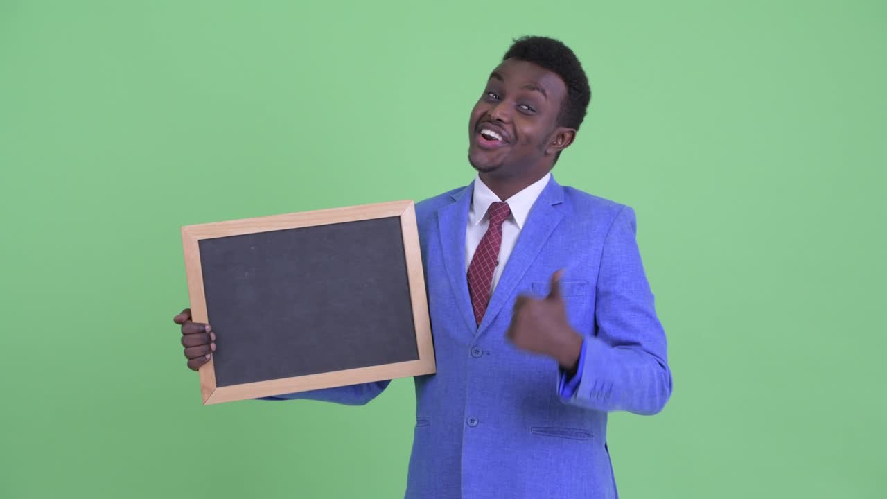 Young African businessman with Afro hair in suit