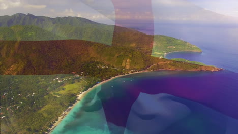 digital composition of waving england flag against aerial view of the sea