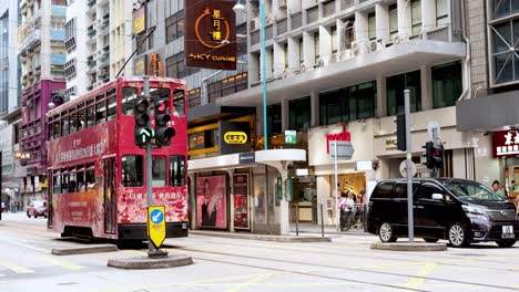 tram and cars at busy hong kong intersection