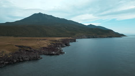 coastal mountain scenery with volcano