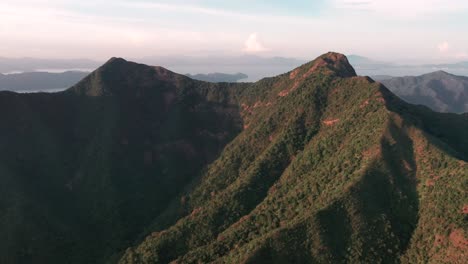 Aerial-dolly-of-mountains-on-sunny-day-near-Ma-On-Shan-Hong-Kong