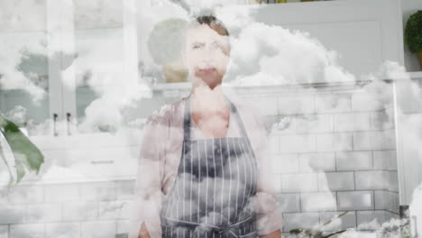 in kitchen, woman wearing apron with cloud animation effect in background