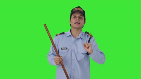 indian security guard telling directions to someone green screen