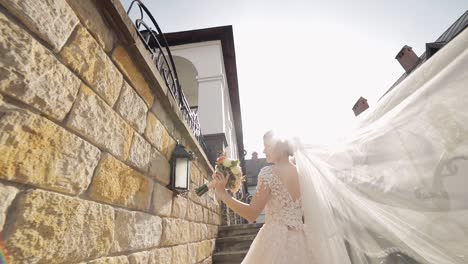 bride walking down the stairs in her wedding dress